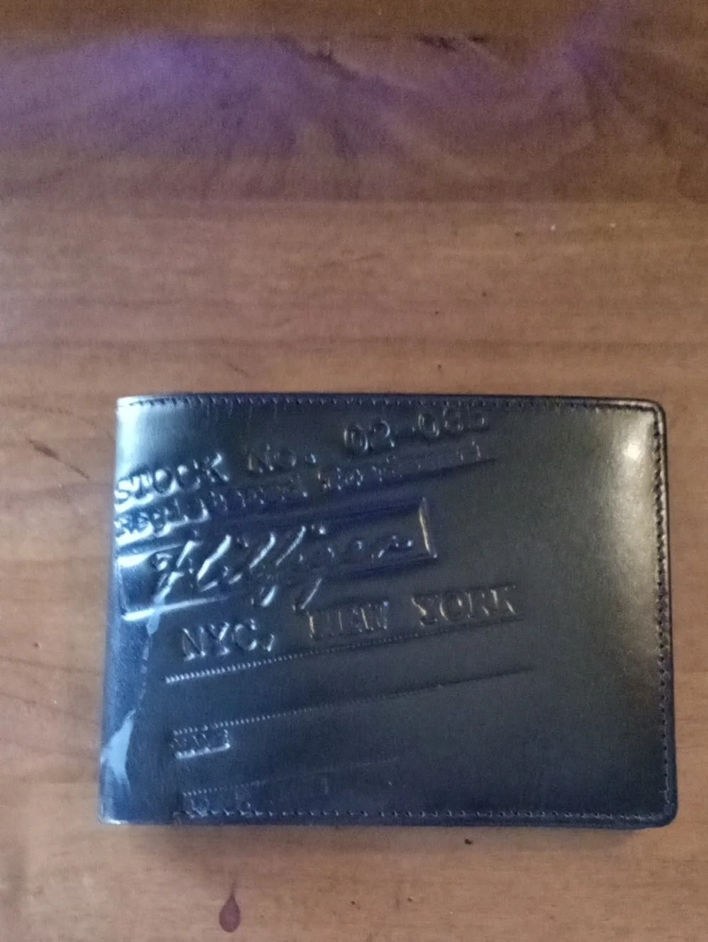 Tommy Hilfiger Black Embossed Leather Bi-Fold Wallet